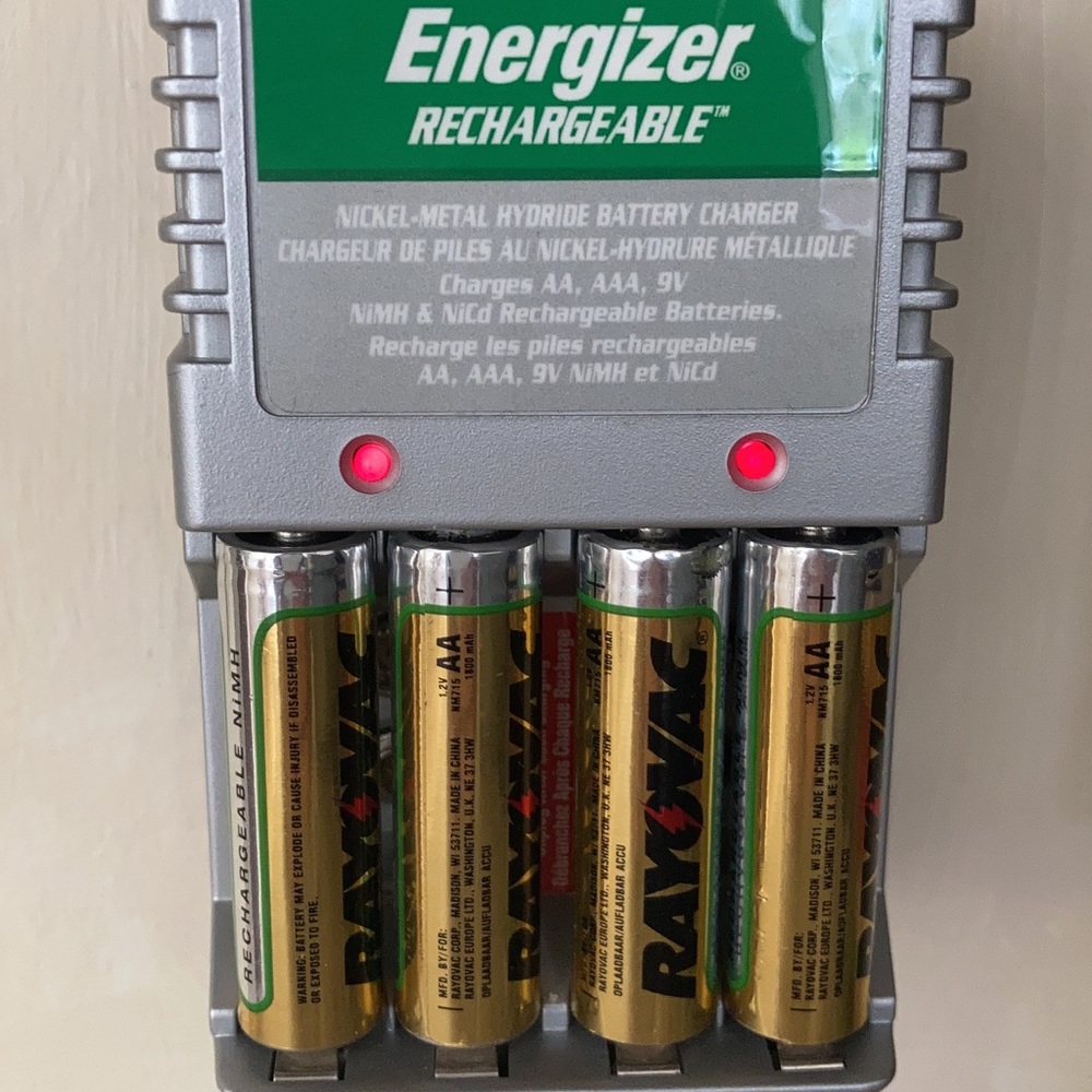 Charger that holds up to 4 rechargeable AA, AAA or two 9 volt batteries